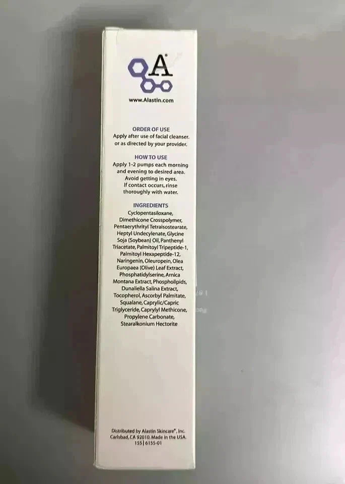 A tall, narrow white product box standing upright against a gray background, showing the back side with printed text and a purple logo.
