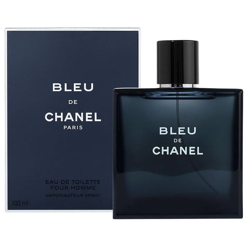 Chanel Bleu de Chanel Eau de Toilette 100ml spray bottle next to its navy blue packaging box, featuring white text and a black cap on a white background.