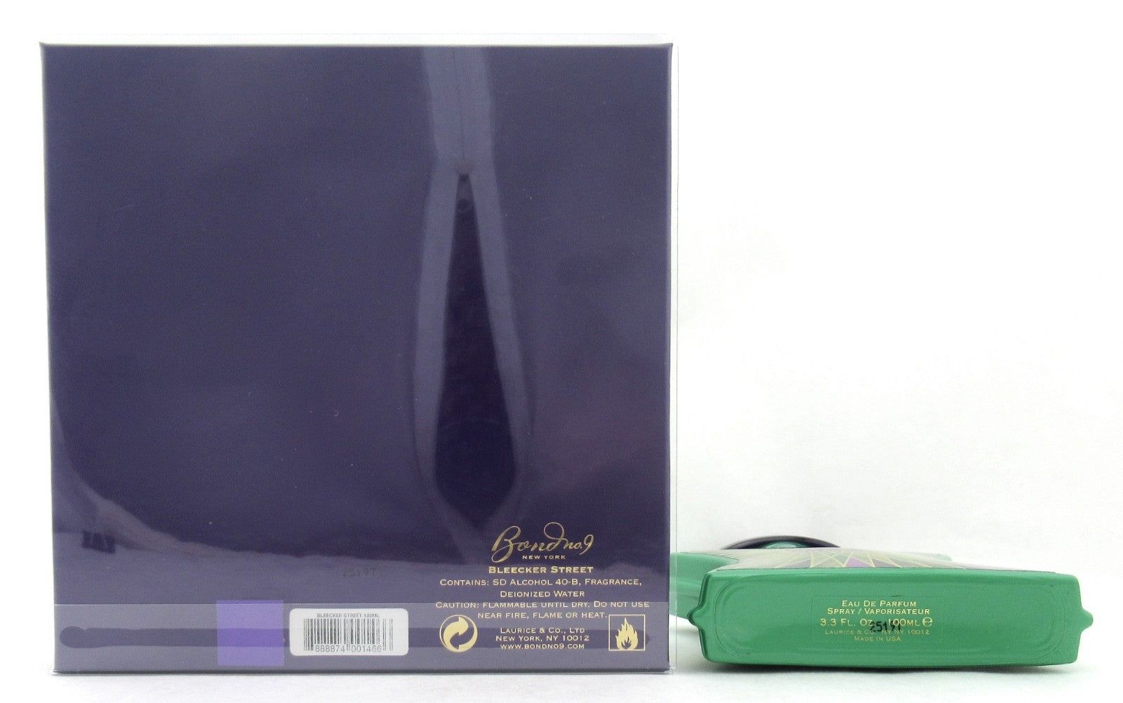 A dark purple rectangular box with gold lettering and a barcode, shown next to a green rectangular item on a plain white background.
