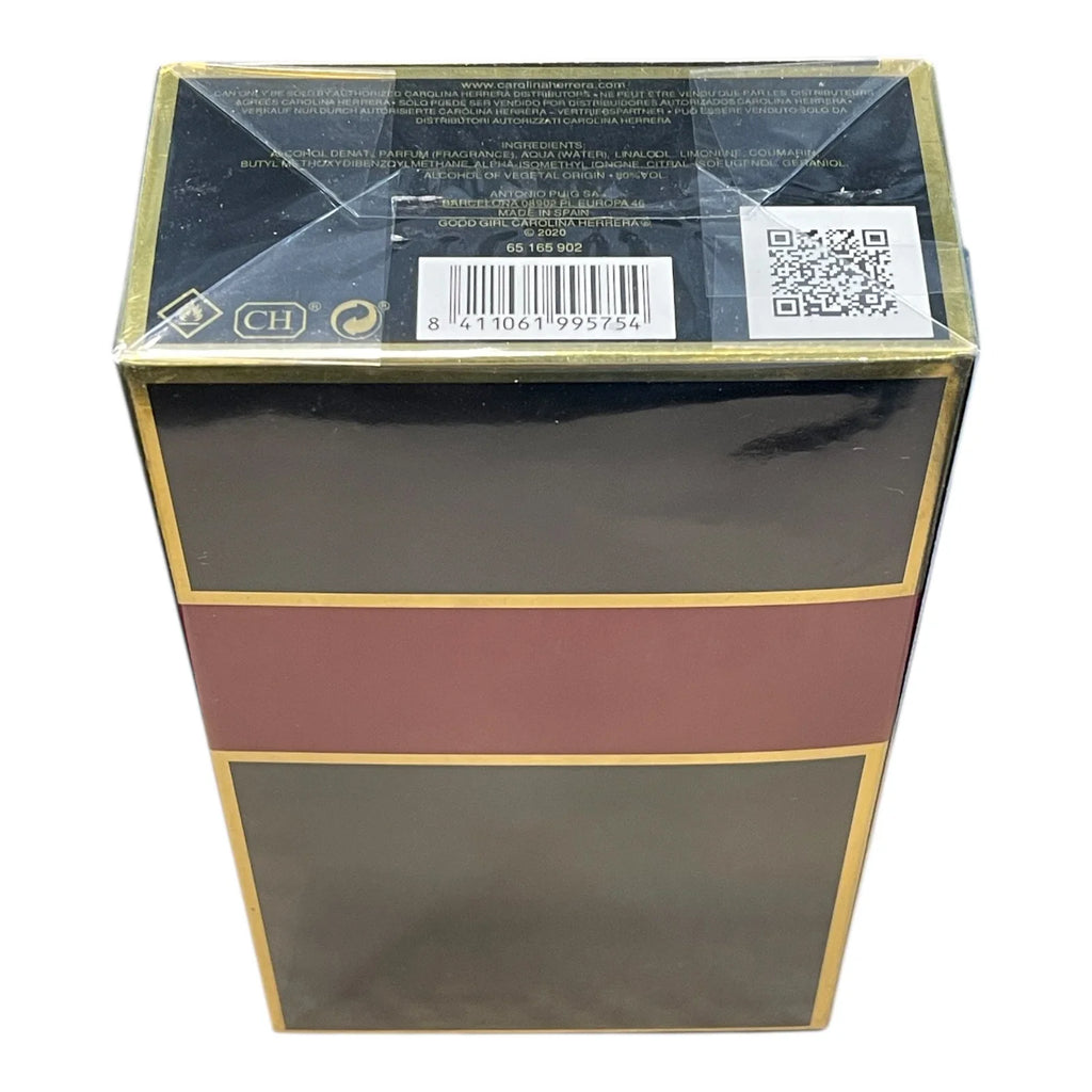 A rectangular product box with a glossy black finish, featuring a wide horizontal burgundy band across the middle and thin gold borders. The top flap is sealed with clear plastic wrap and shows a barcode, QR code, and small certification logos.