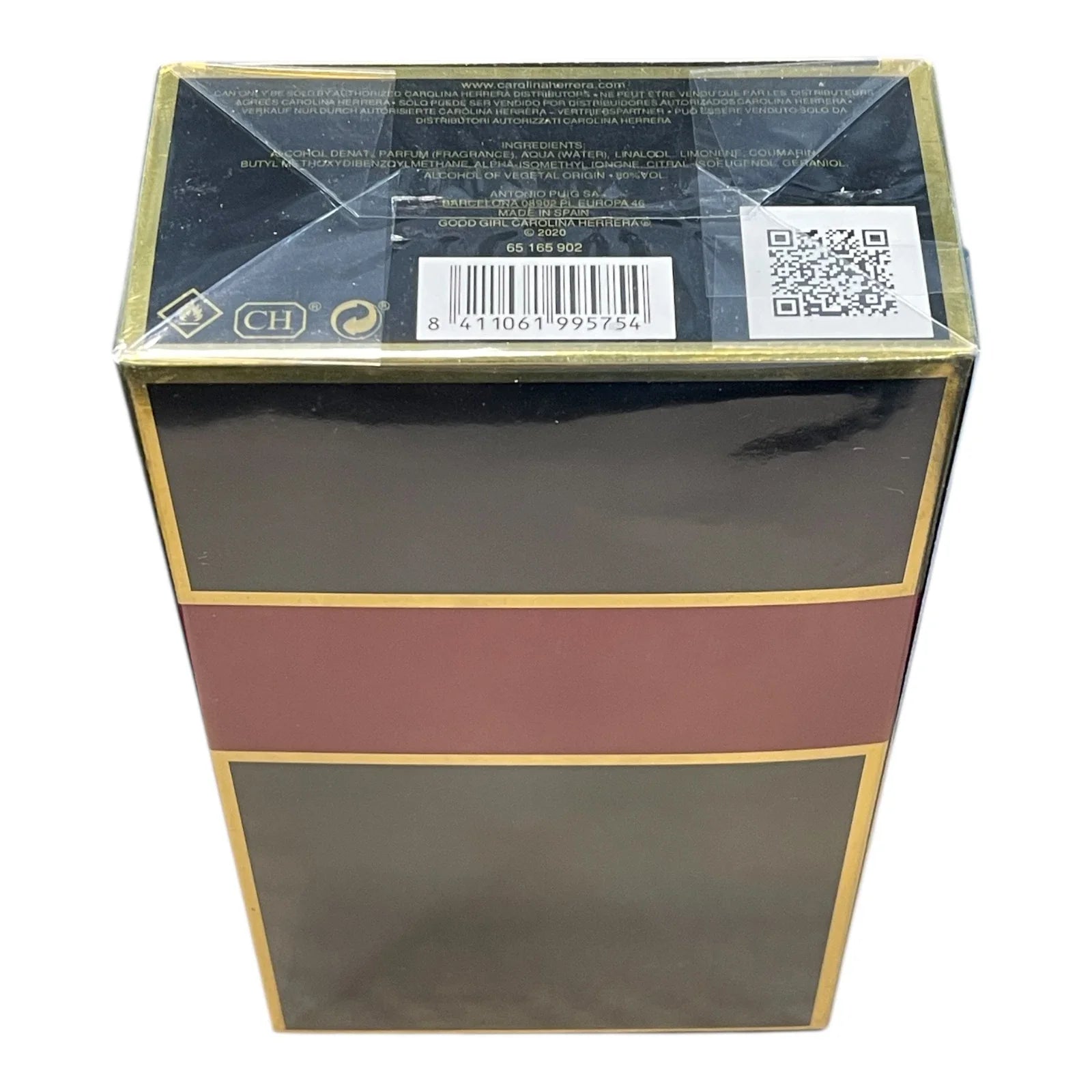 A rectangular product box with a glossy black finish, featuring a wide horizontal burgundy band across the middle and thin gold borders. The top flap is sealed with clear plastic wrap and shows a barcode, QR code, and small certification logos.