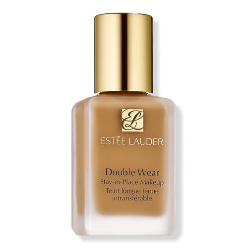 Estée Lauder Double Wear Stay-in-Place Makeup foundation bottle with a gold cap and a warm tan-brown liquid visible through the frosted glass, on a white background.
