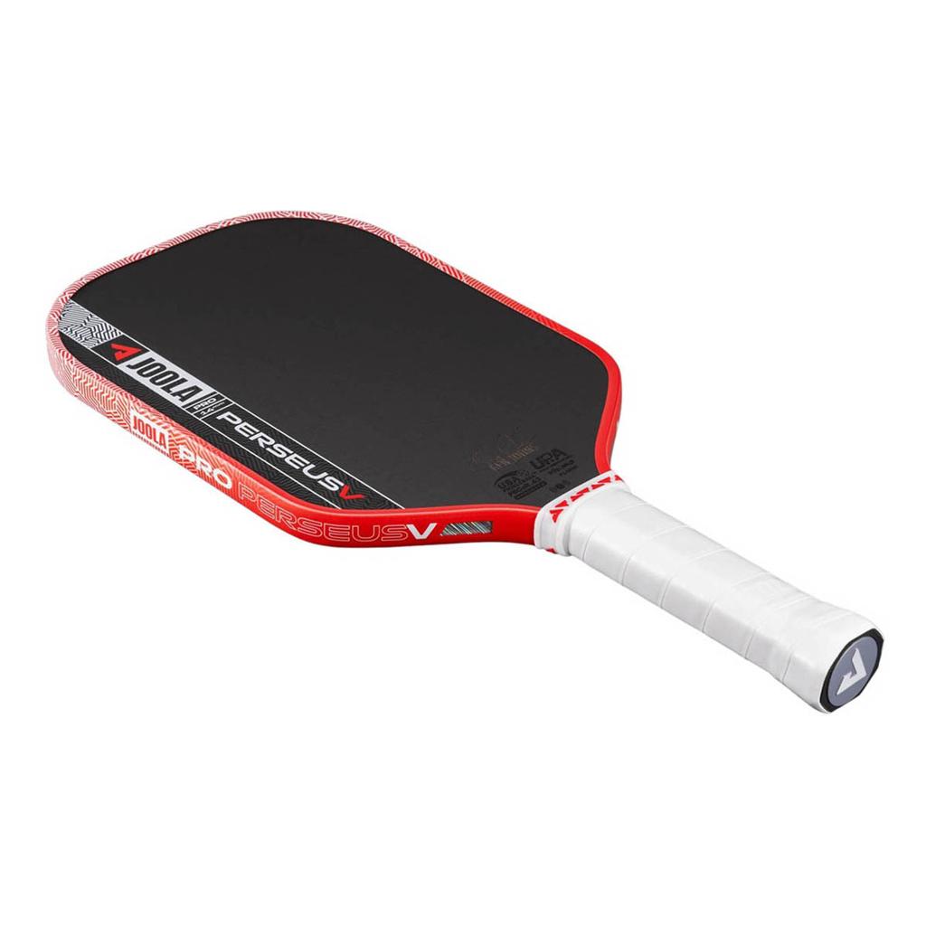 A pickleball paddle featuring a black performance grip face, a red outer frame, a white wrapped handle, and white and red branding on a clean white background.