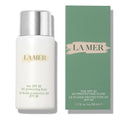 La Mer The SPF 50 UV Protecting Fluid bottle in white with a silver cap, shown next to its green packaging box on a white background.