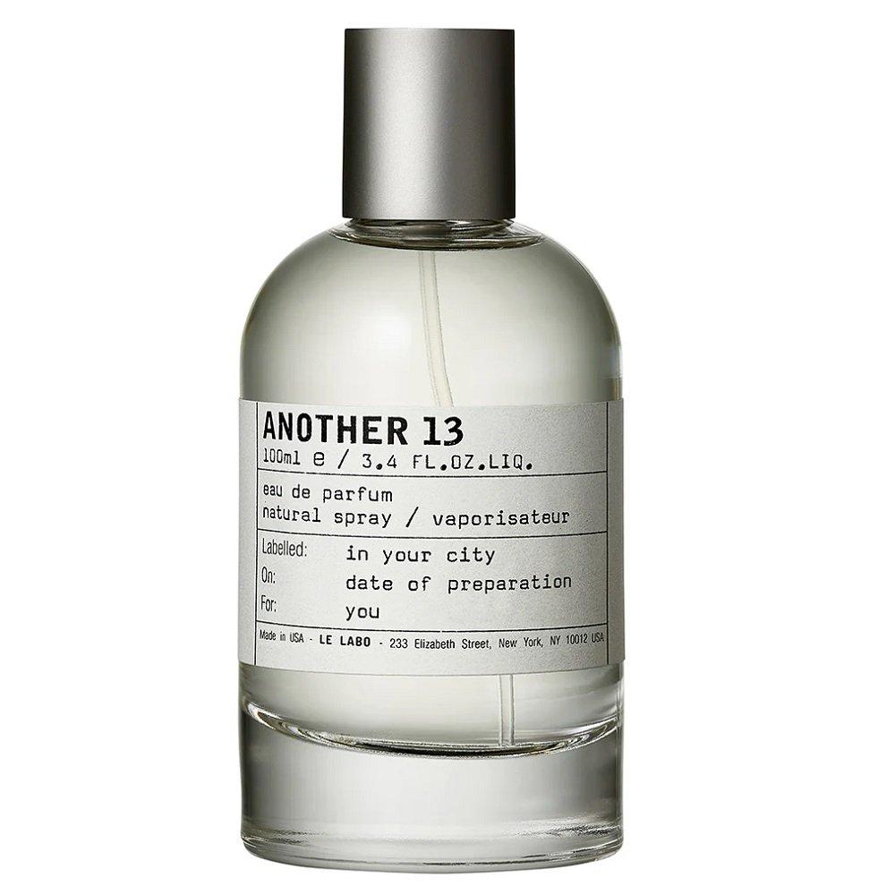 A 100ml bottle of LE LABO Another 13 Eau de Parfum, featuring a clear glass bottle with a silver metallic cap and a minimalist white label with black text, set against a plain white background.