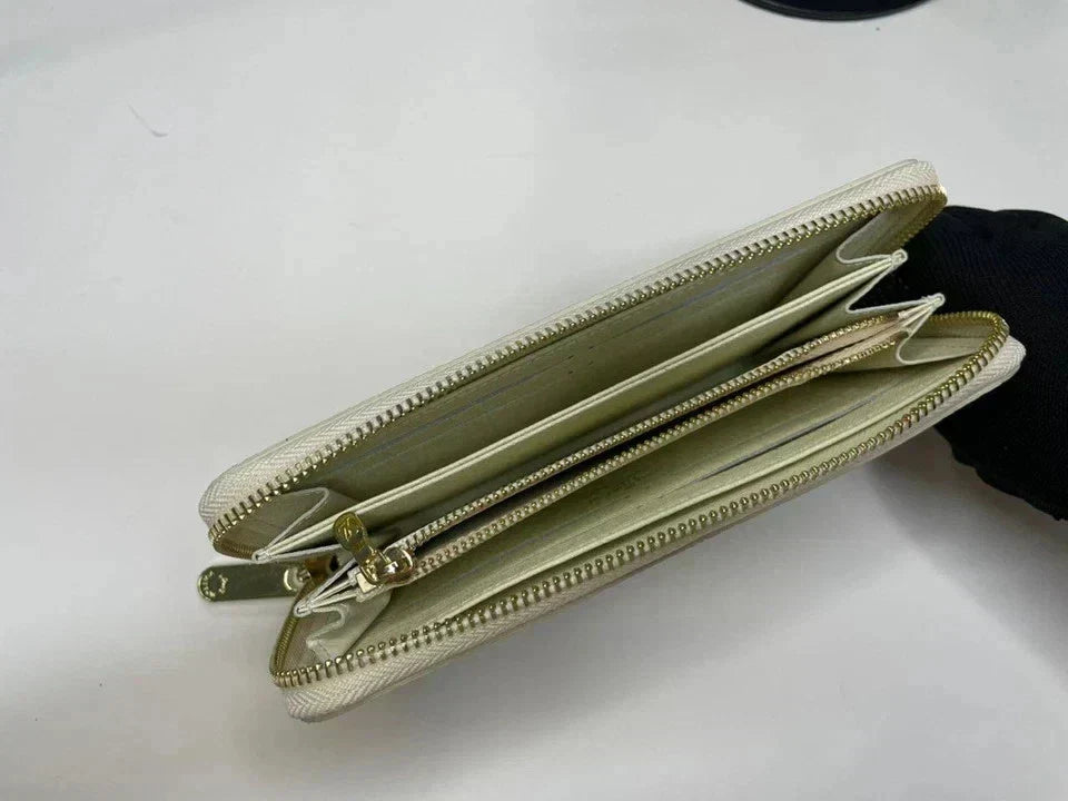 Gold zipper wallet on a white background