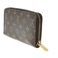 Designer wallet with monogram pattern on a white background