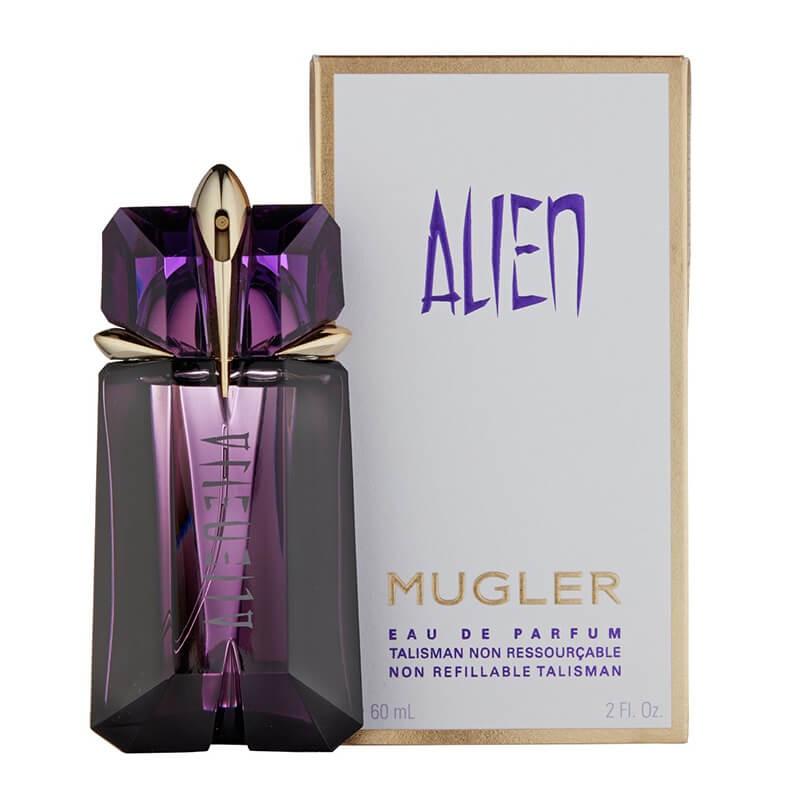 Mugler Alien Eau de Parfum bottle with a faceted purple crystal design and gold cap, shown next to its white and gold packaging box featuring the purple Alien logo.