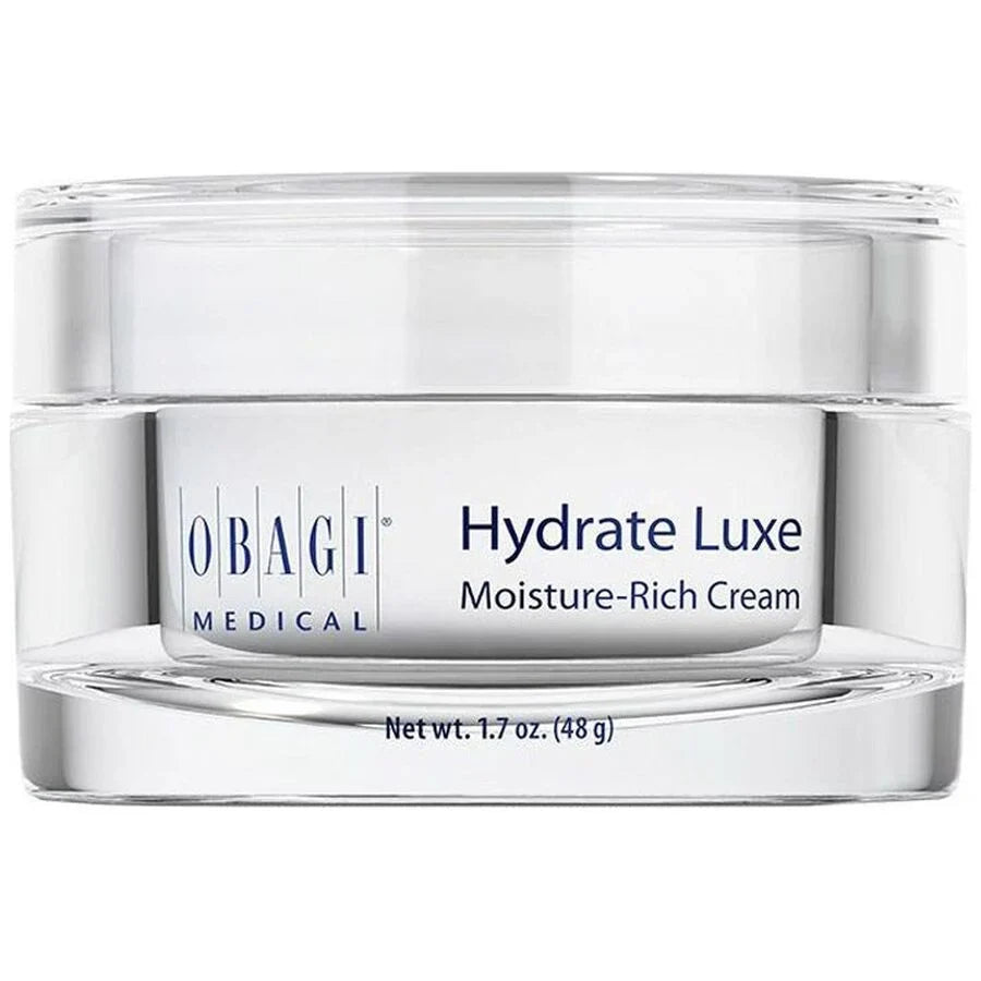 A clear cosmetic jar of Obagi Medical Hydrate Luxe Moisture-Rich Cream with a white label and silver-toned base, shown on a white background.