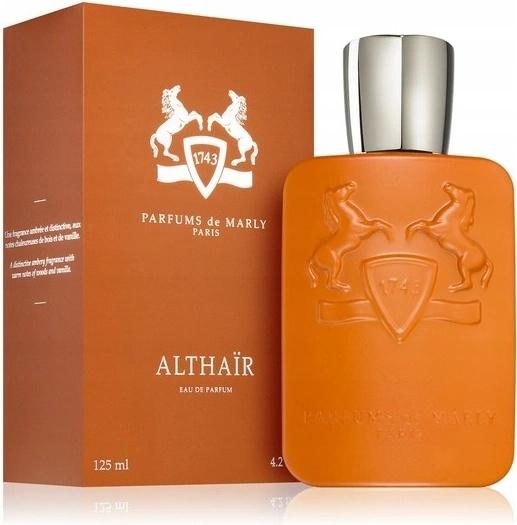 Althair Eau de Parfum by Parfums de Marly, featuring a square orange bottle with a silver cap next to its matching orange packaging box.