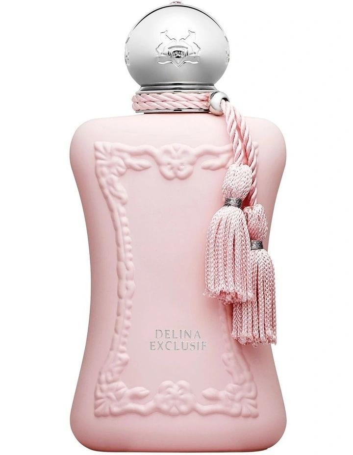 A pink perfume bottle with an embossed floral border design, a silver spherical cap, and a pink braided cord with tassels, labeled 'DELINA EXCLUNIF'.