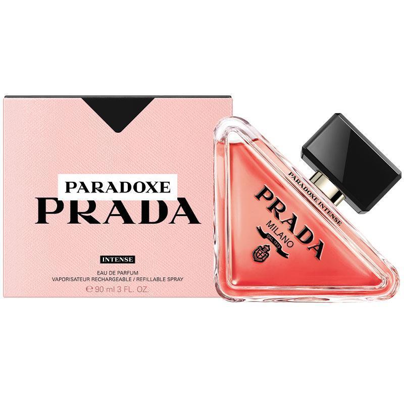 Prada Paradoxe Intense Eau de Parfum bottle next to its pink packaging box on a white background.