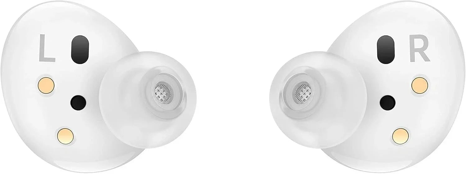 A pair of white wireless earbuds with transparent silicone tips, featuring gold and black sensor accents and L/R markings on a plain white background.