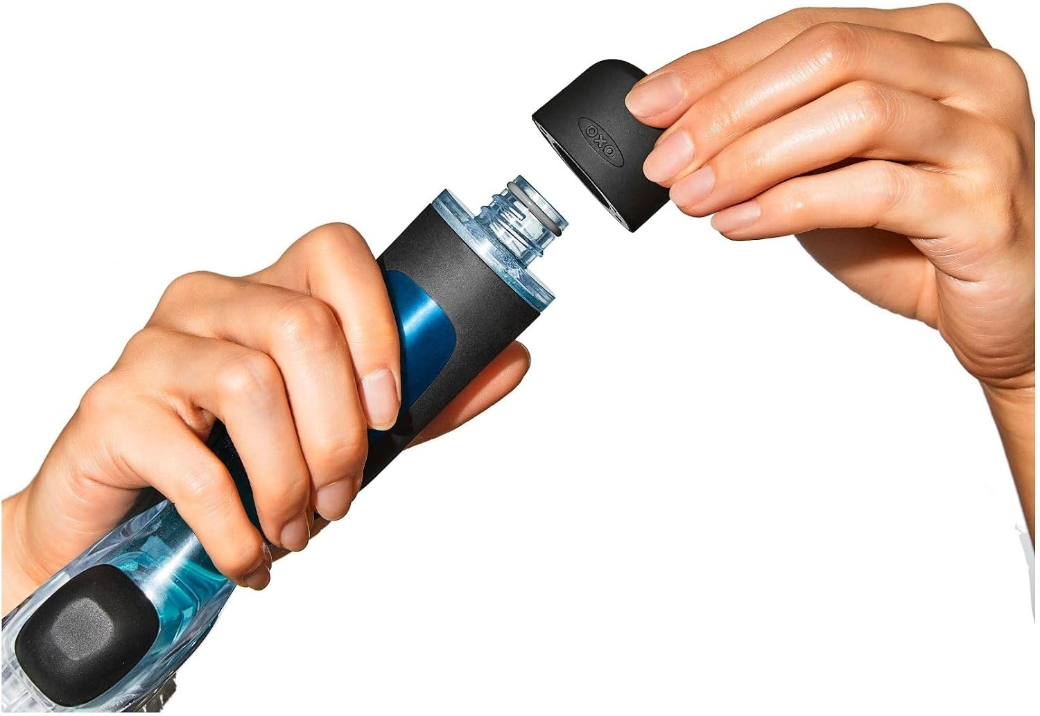 Person opening a blue and black water bottle with a white background