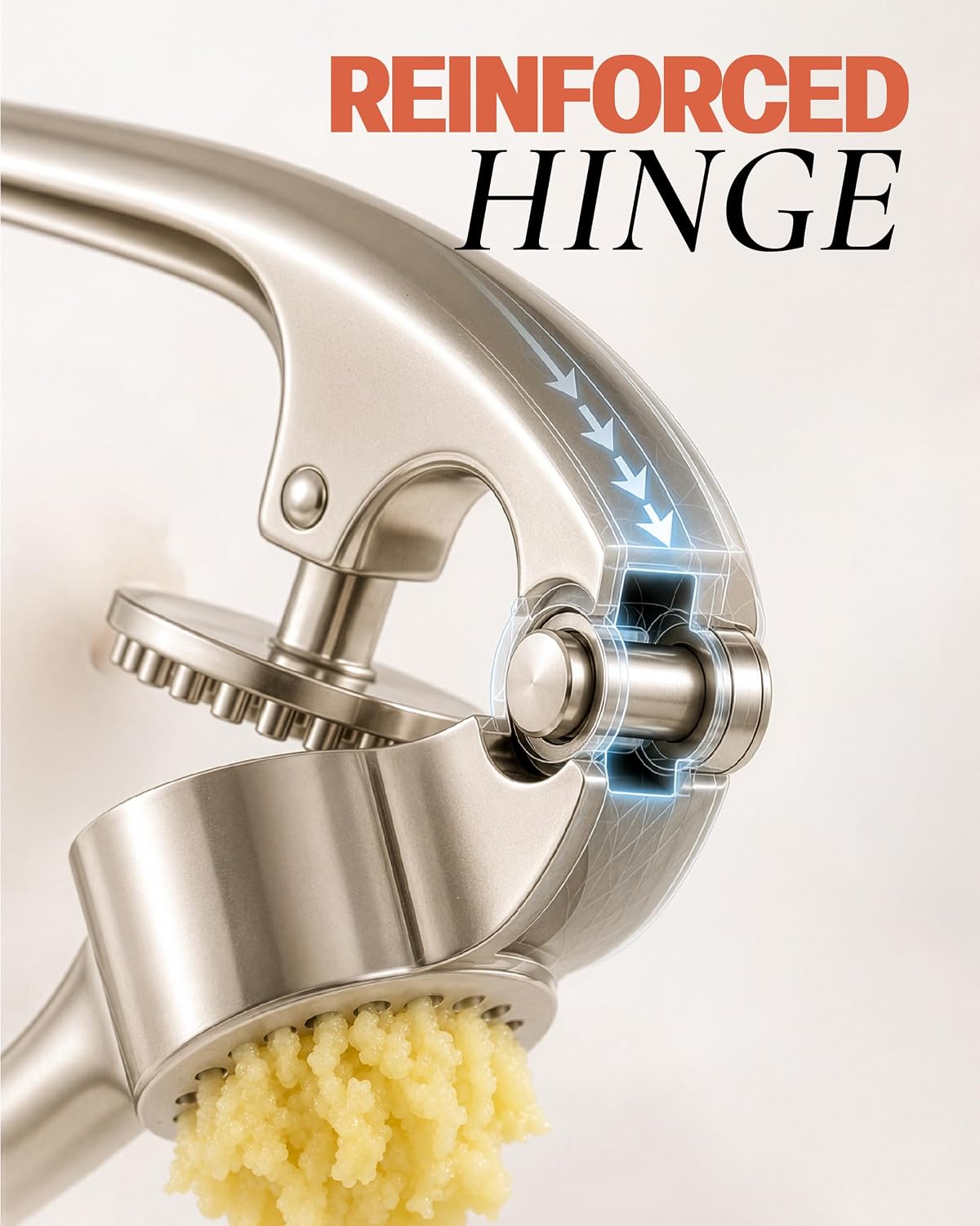 Close-up of a stainless steel garlic press with a cutaway illustration showing a reinforced hinge, on a light background with the text 'REINFORCED HINGE' at the top.