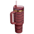 Pink tumbler with handle and straw lid on a white background