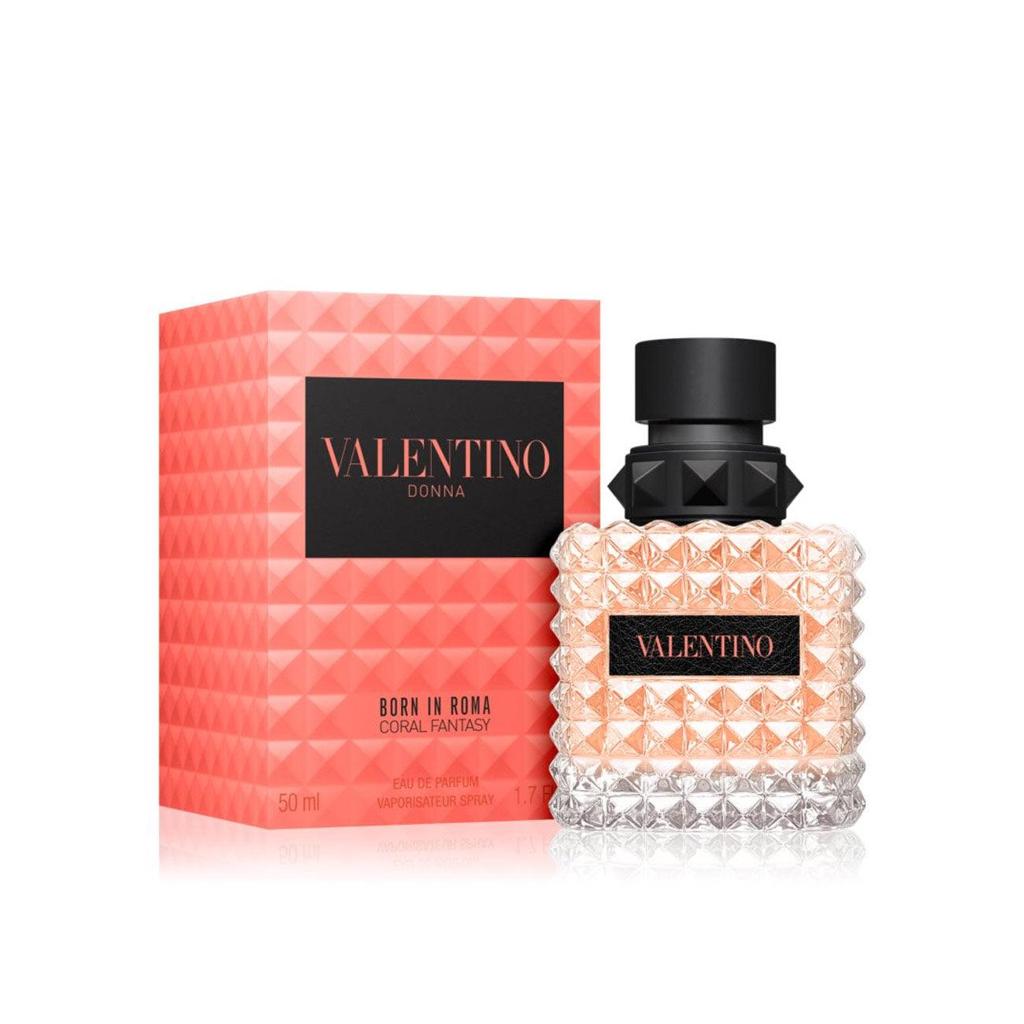 Valentino Donna Curval Fantasy perfume bottle and its packaging box, featuring a textured clear glass bottle with a black cap and a coral pink geometric box.