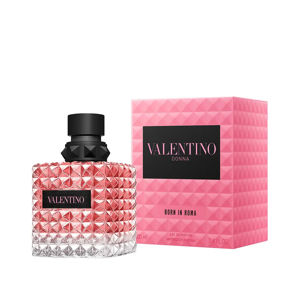 Valentino Donna Born in Roma Eau de Toilette bottle with a pink faceted crystal design and a black cap, shown next to its pink geometric box on a white background.