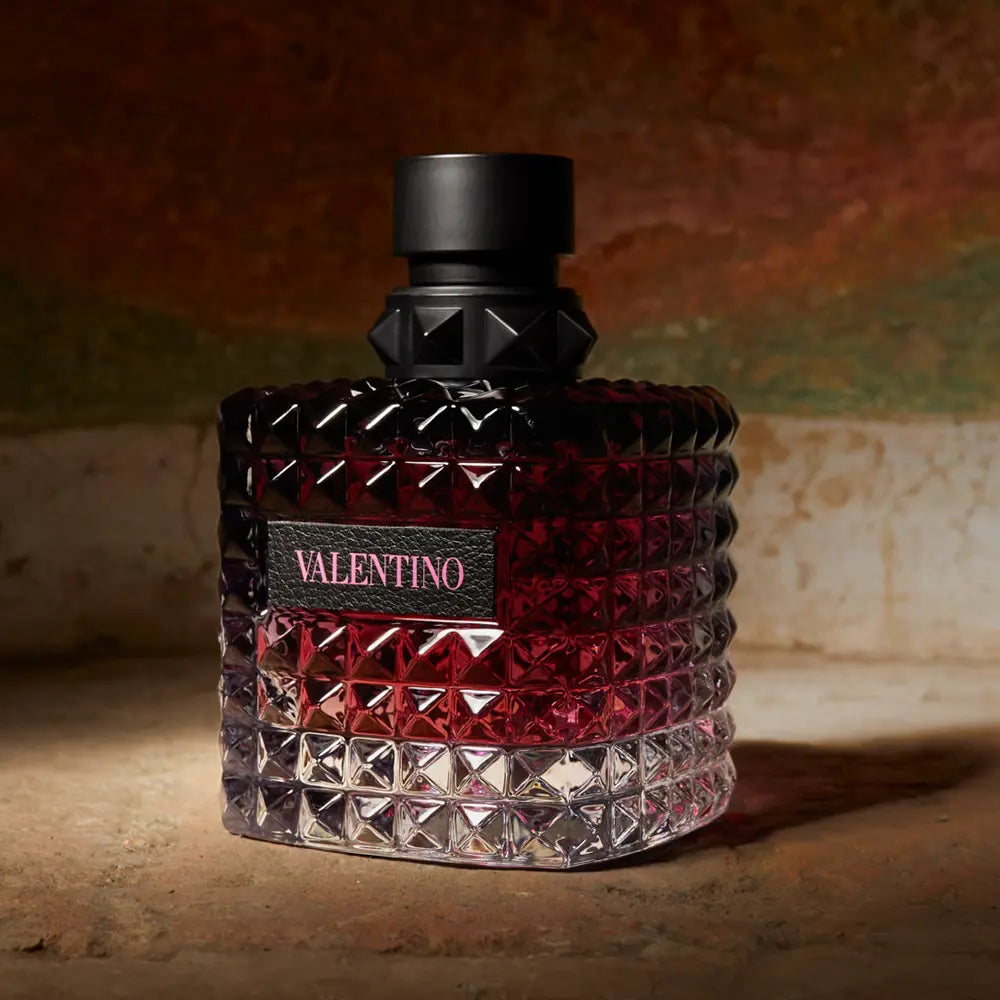 Valentino perfume bottle with textured design on a textured surface