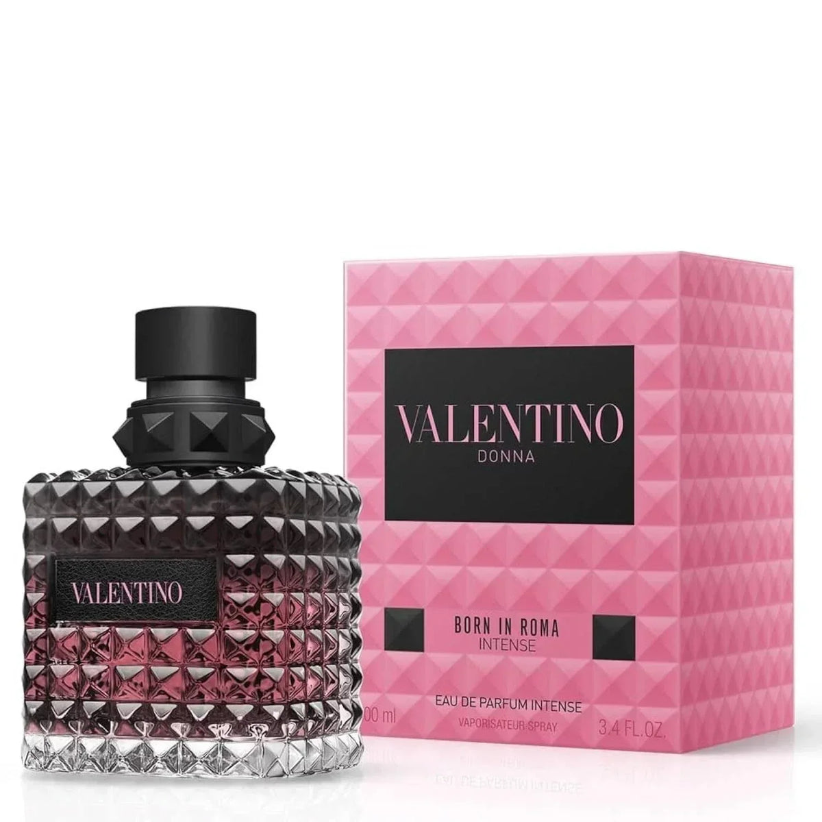 Valentino Donna Born in Roma Intense Eau de Parfum bottle with a textured faceted glass design and black cap, shown next to its pink geometric-patterned box.