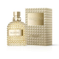 Valentino Crème perfume bottle and its matching textured packaging box, both in a champagne gold color, on a clean white background.