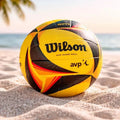 Wilson AVP game ball on a sandy beach with ocean view